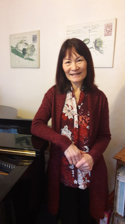 Loc Mai next to Piano